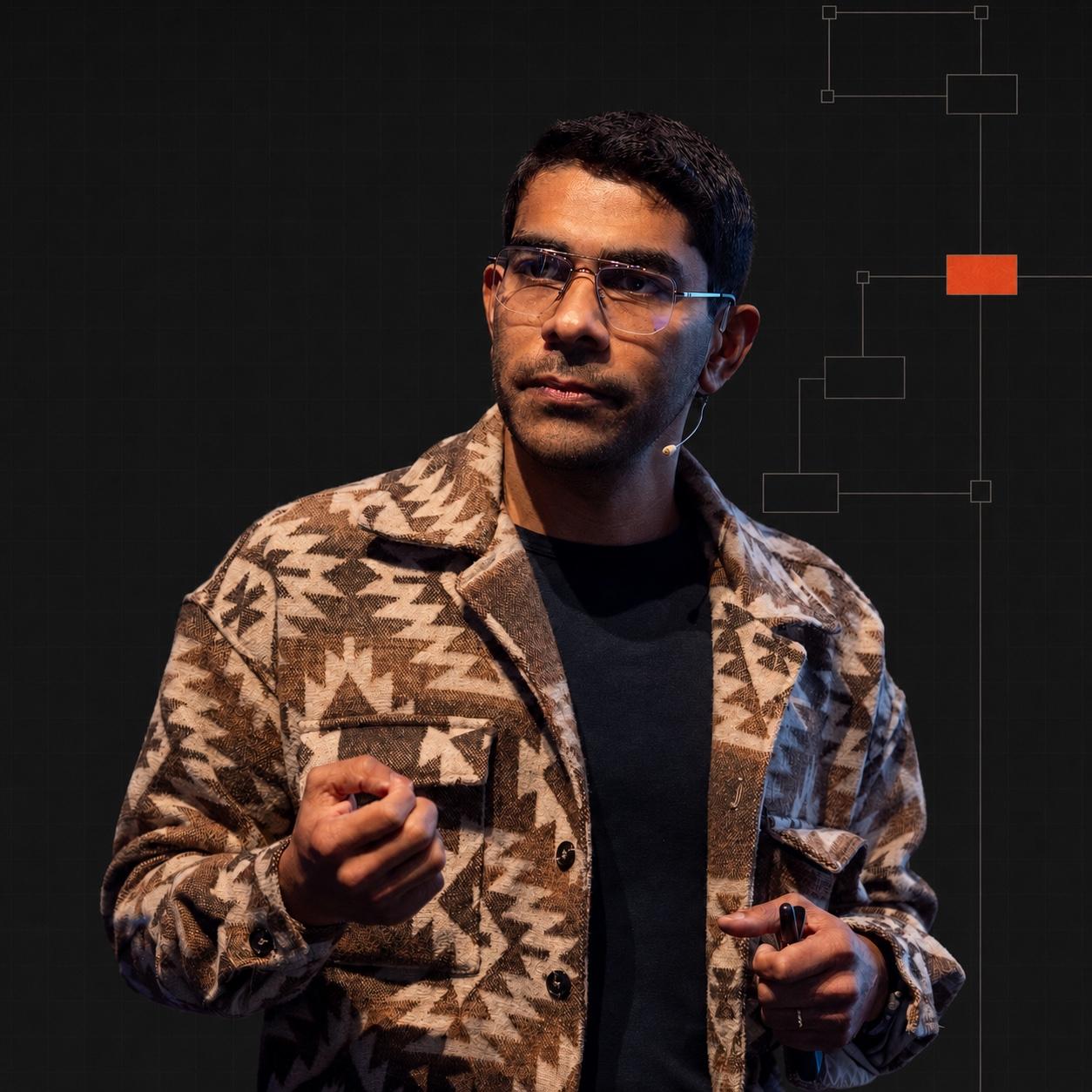 Abhimanyu Selvan speaking on stage